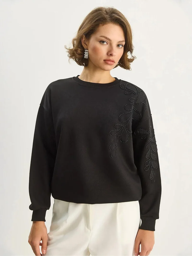 بيانكو لوتشي سويت شيرت بأكمام طويلة وياقة دائرية مطرز من لوتشي