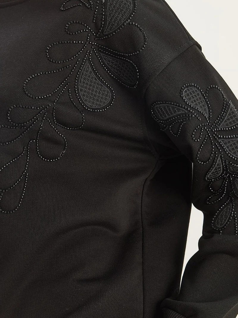 بيانكو لوتشي سويت شيرت بأكمام طويلة وياقة دائرية مطرز من لوتشي