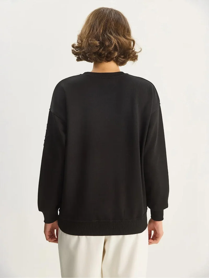 بيانكو لوتشي سويت شيرت بأكمام طويلة وياقة دائرية مطرز من لوتشي