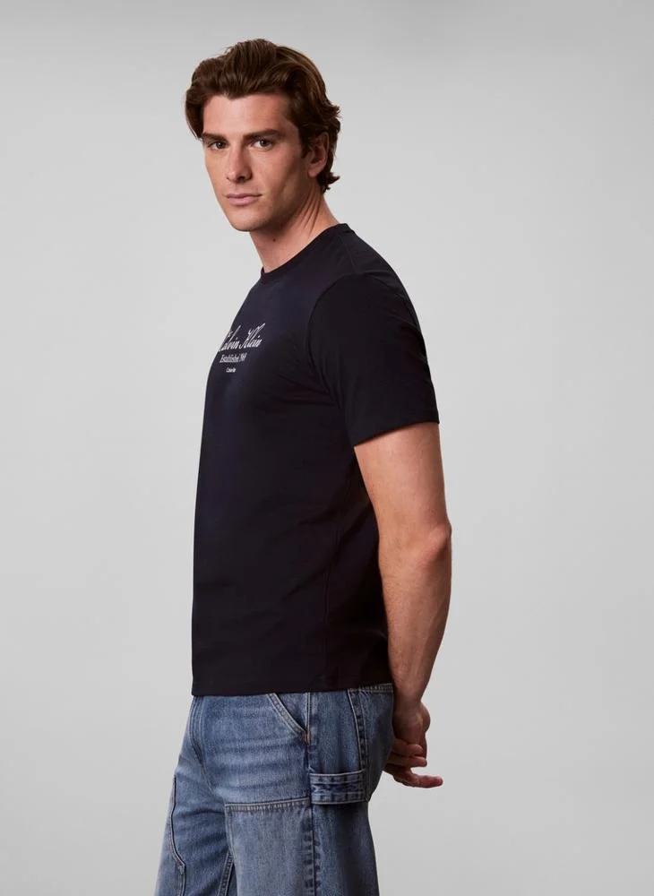 Calvin Klein Jeans  Script Logo Graphic T-Shirt for Men | Best Price UAE
