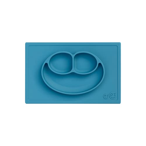 ezpz Happy Mat - 100% Food Grade Silicone Suction Plate with Built-in Placemat for Toddlers Smile Design Plates Promotes Baby Led Weaning - Divided Plate - Microwave & Oven Safe - 24months+ (Blue) - Image 1