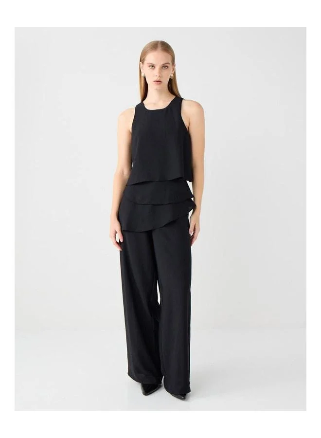Jimmy Key Black plain-cut woven Tulum with fringe details.
