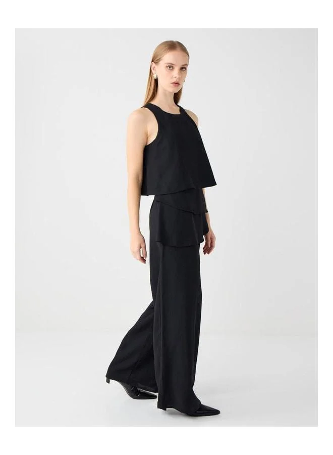 Jimmy Key Black plain-cut woven Tulum with fringe details.