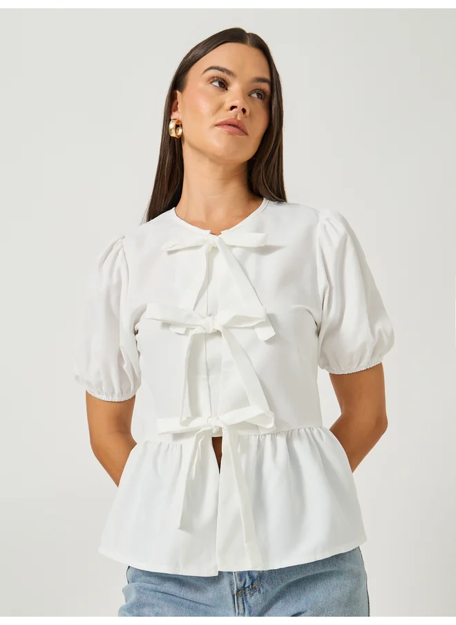Styli Styli Plain Puff Sleeves Peplum Top with Tie Detail