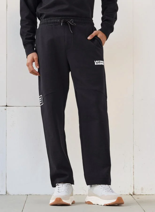 SP Characters Men Relaxed Fit Flexi Waist Track Pants with NFL Print