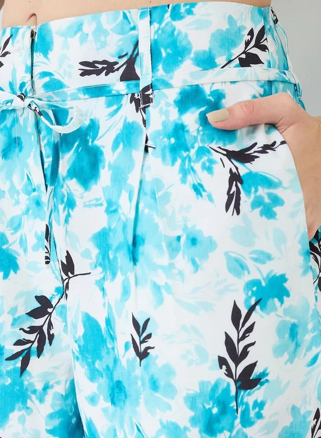 جلو باص طقم قميص قصير مطبع بالزهور مع بنطال بأرجل واسعة