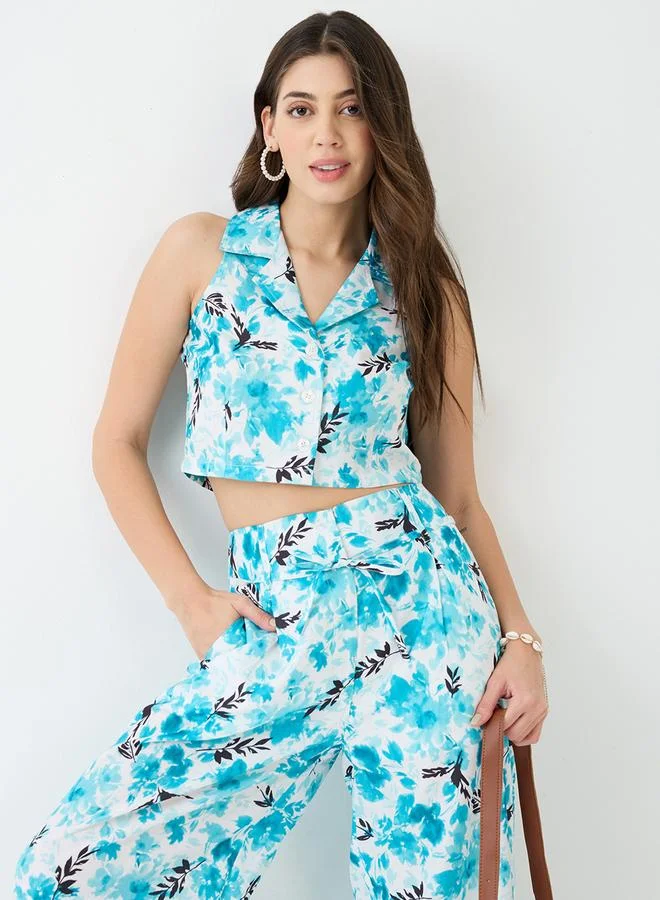 جلو باص طقم قميص قصير مطبع بالزهور مع بنطال بأرجل واسعة