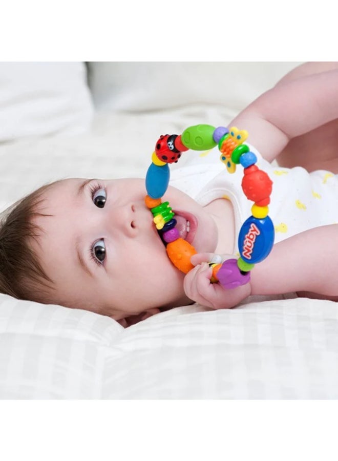 Nuby Bug A Loop Teether Toy, Multi-Texture Sensory Teether for Babies, Easy Grip Developmental Toy for Teething Relief and Play, Assorted - Image 4