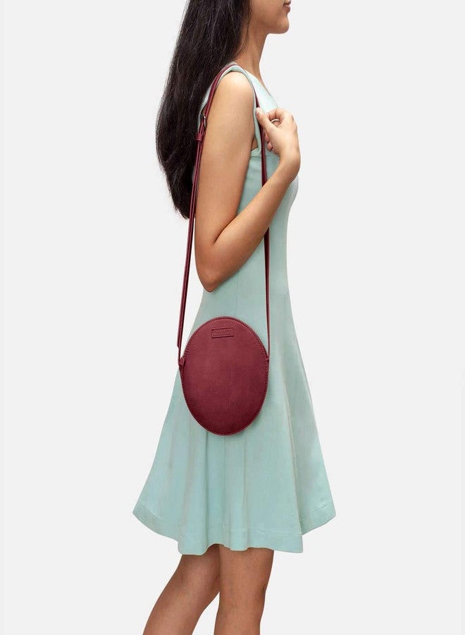 DailyObjects Orbis Round Sling Crossbody Bag For Women| Stylish Solid Burgundy Faux Leather Purse With Slip Pocket & 2 Compartments Inside| Zip Closure & Adjustable Strap| Storage Space For Essentials - Image 2