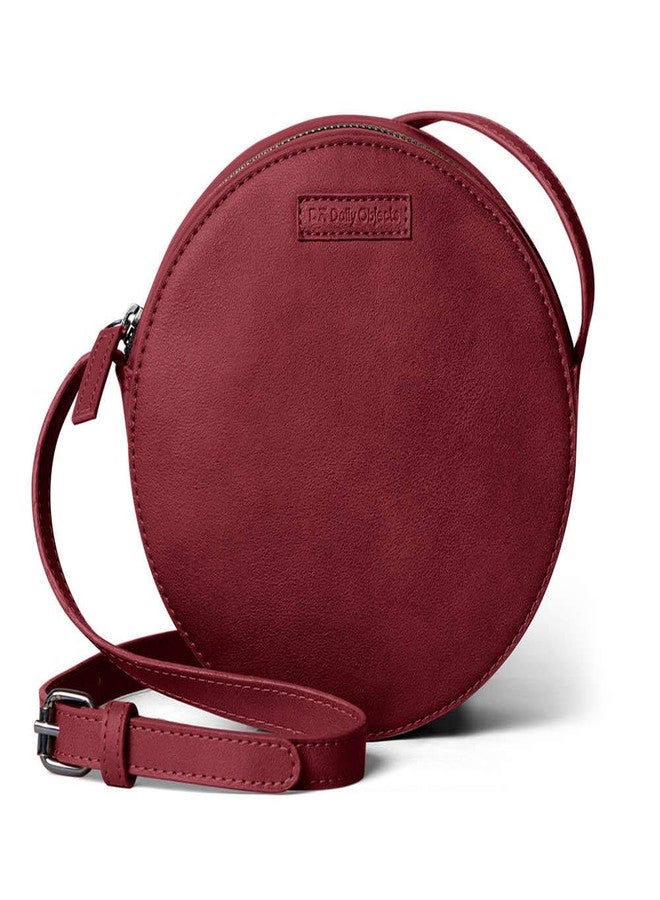 DailyObjects Orbis Round Sling Crossbody Bag For Women| Stylish Solid Burgundy Faux Leather Purse With Slip Pocket & 2 Compartments Inside| Zip Closure & Adjustable Strap| Storage Space For Essentials - Image 1