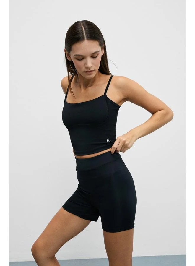 URBAN BEAT Shavonte Women's Strappy Black Sports Bustier with Under-Bust Piping Details.