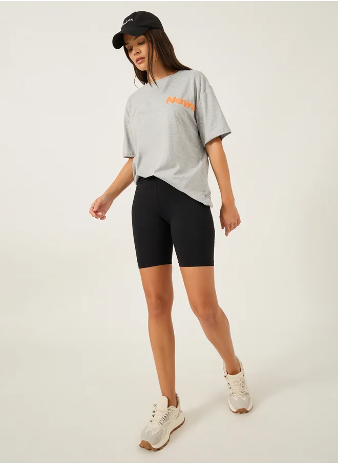ستايلي Slogan Print Round Neck Oversized T-Shirt