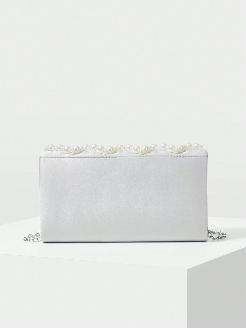 حقيبة سهرة نسائية مزينة باللؤلؤ بتصميم فاخر باللون الأبيض مناسبة للأعراس والمناسبات الرسمية - Image 5