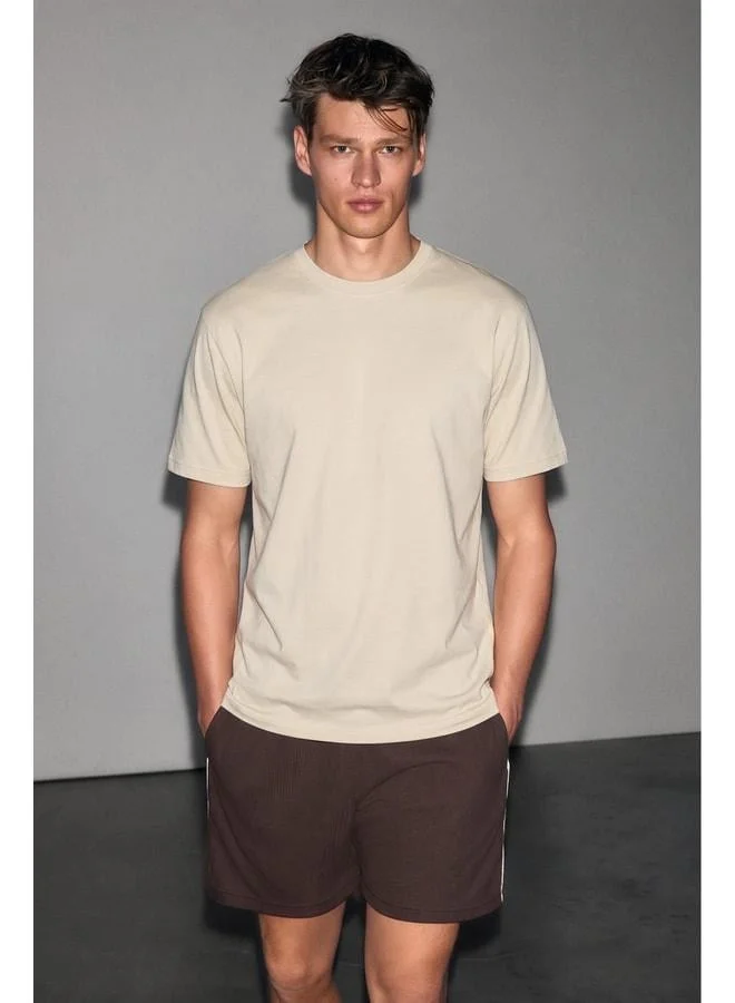 GRIMELANGE FAYIN Men's Soft and Stretchy Fabric Organic Cotton Round Neck Beige T-Shirt.