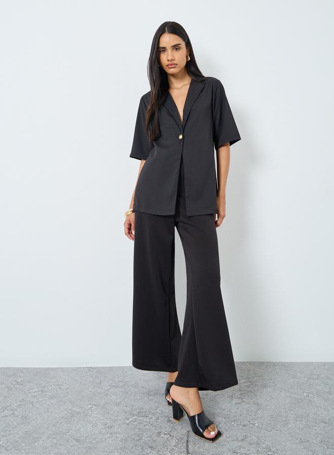 ستايلي بلوزة بقصة بوكسي وأكمام قصيرة - Image 2