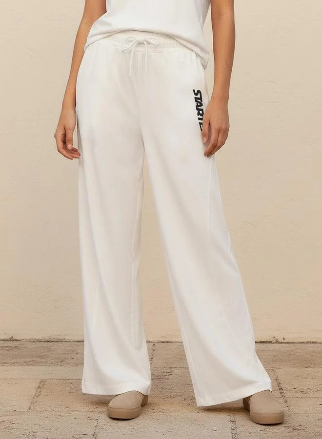 سبلاش فيڤ Wide Leg Mid Rise Joggers with Text Print