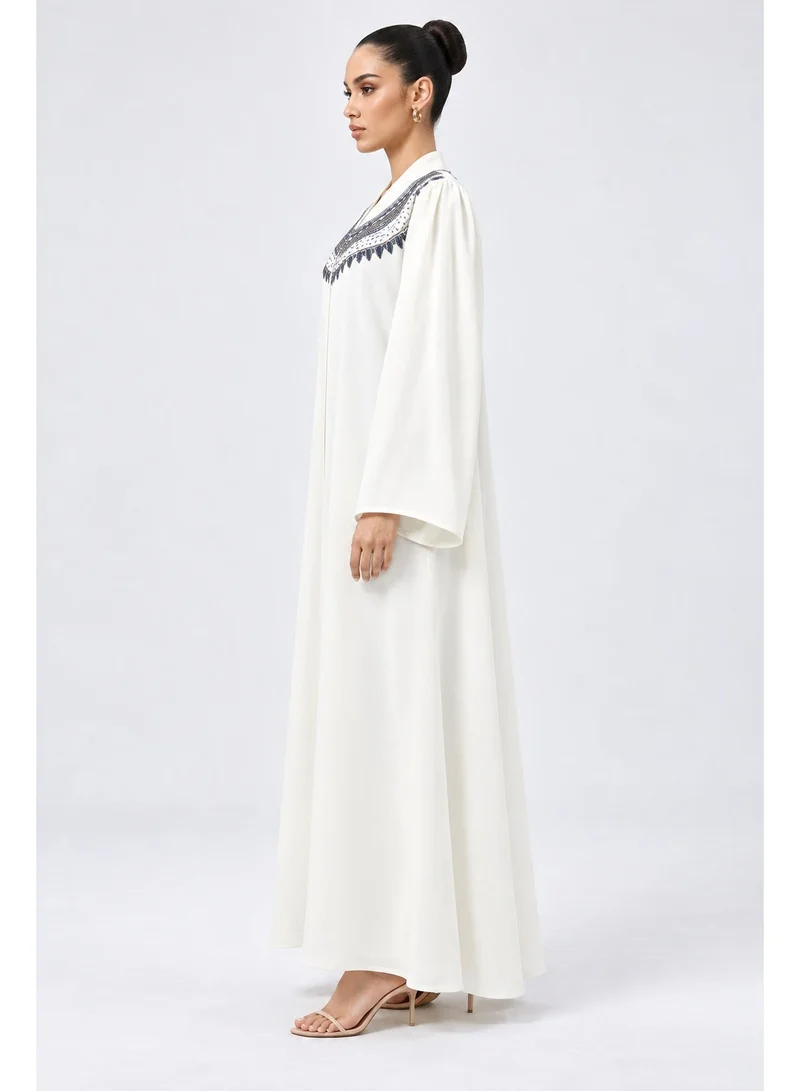 Aara Ivory White Abaya with Navy Blue Embroidery & Beaded Neckline, Wide Sleeves