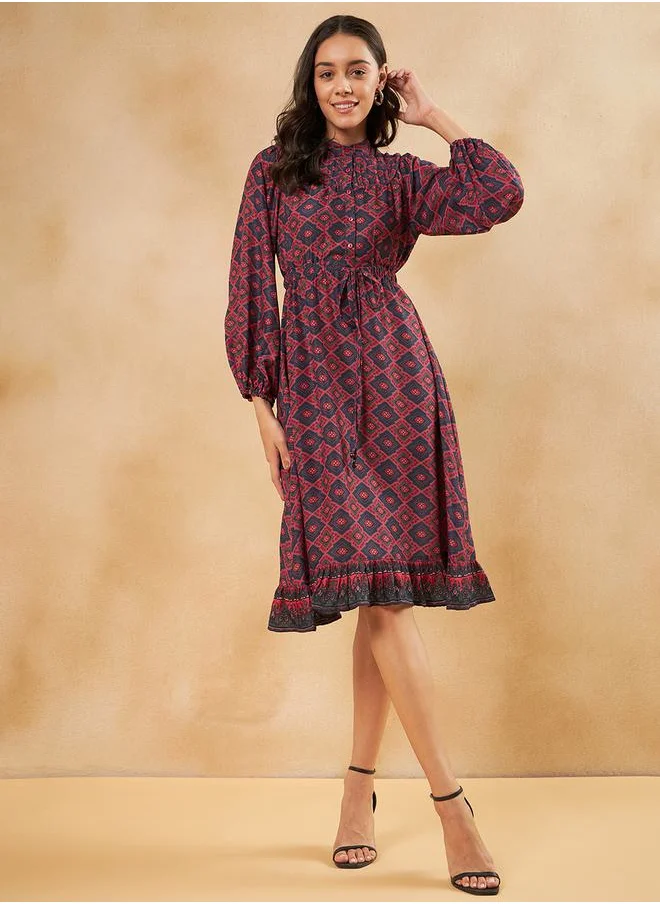 FEMELLA All Over Print Knee Length Dress with Tie Up by Styli