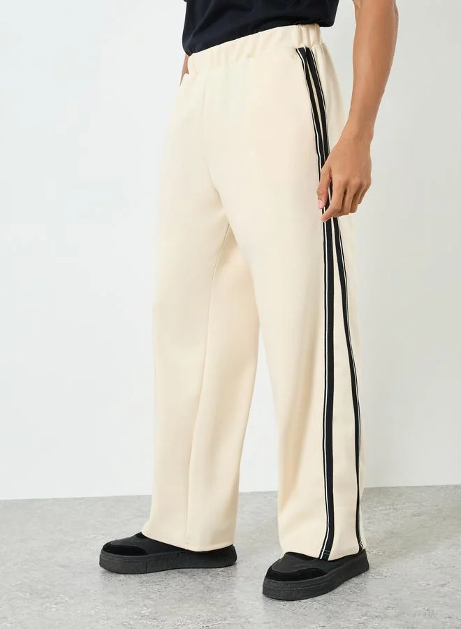 Styli Men Cream Side Taping Striped Oversized Joggers