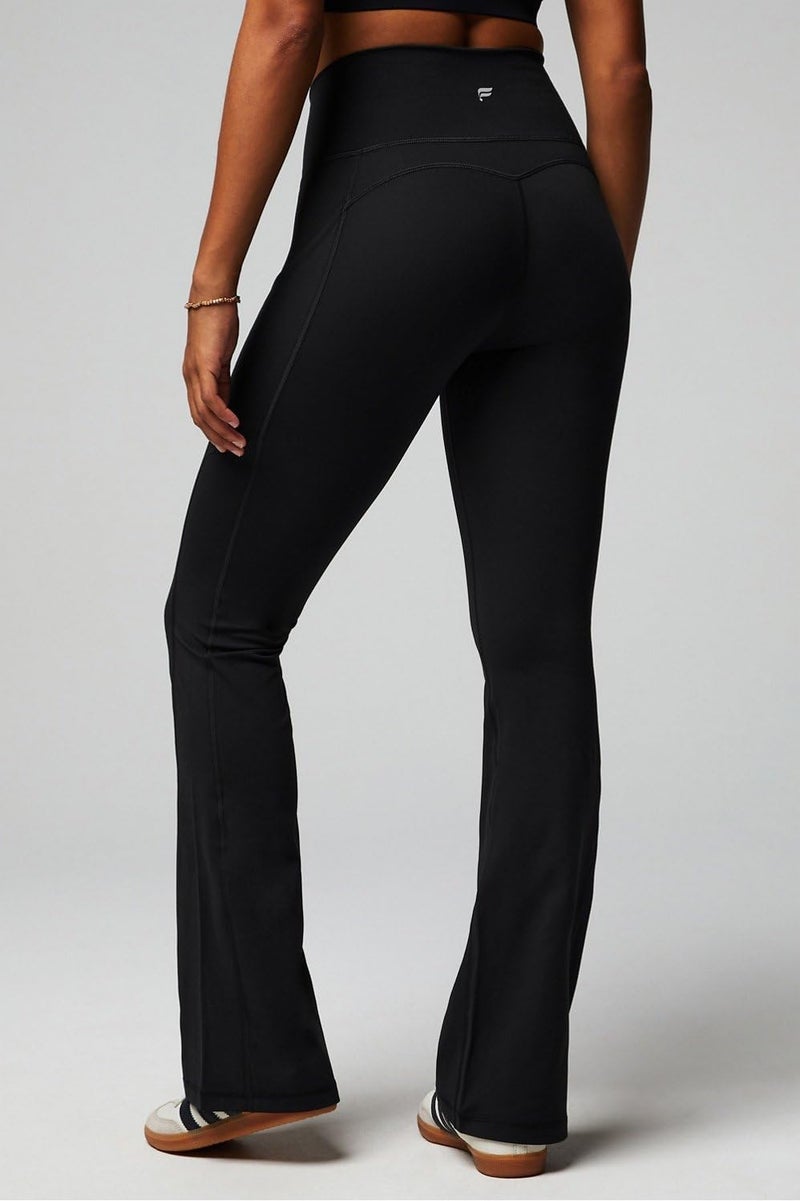 Fabletics Women's Oasis Pureluxe High-Waisted Pocket Kick Flare, Light Compression, Buttery Soft, L, Black - Image 1