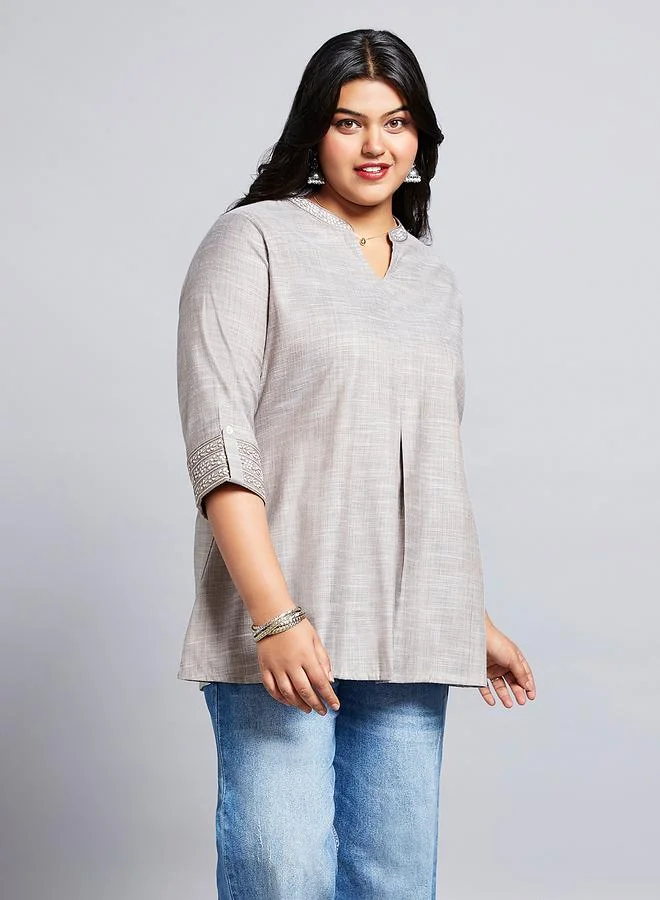 جلو باص تونيك بمقاس كبير مع أكمام بطول 3/4