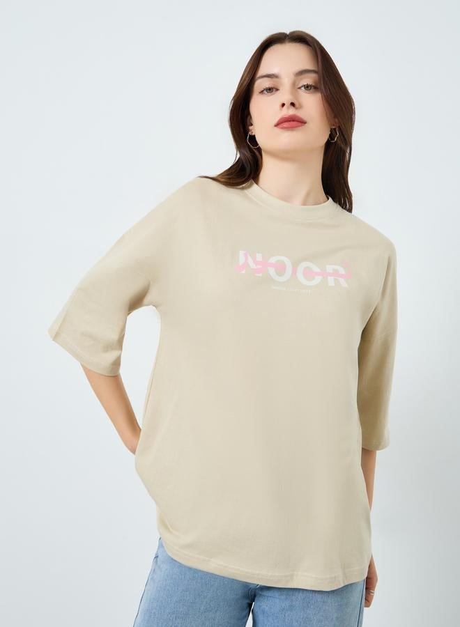 Styli Women Beige Slogan Print Oversized T-Shirt - Image 1