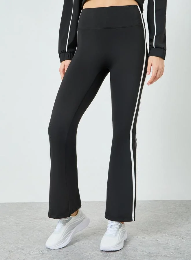 Styli Active  Women Black Contour Piping Full Zip Jacket and and Flared Pants Set for Women | Best Price UAE