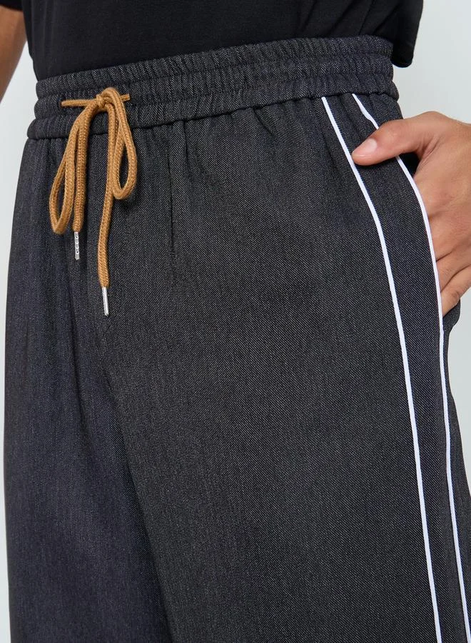 تايك تو بنطال سادة بخطوط جانبية وخصر رباط