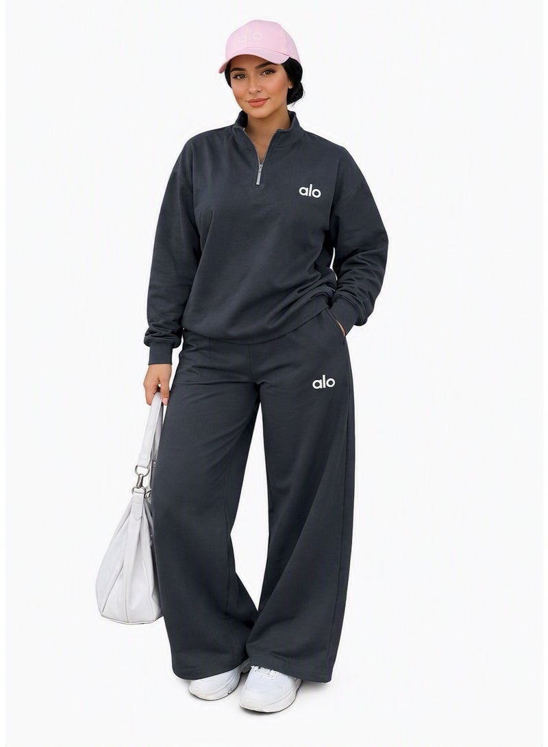 Marketing Description:   Stand out with the ALO Women’s Dark Grey Tracksuit. A stylish design that blends comfort and flexibility, giving you confidence and elegance whether at the gym or on casual outings. The printed ALO logo adds a premium touch that reflects the brand’s identity.  🔍 Features & Specifications:  High-quality fabric for softness and breathability.  Comfortable sweatshirt with a modern fit.  Wide-leg pants with elastic waistband for a perfect fit.  Printed ALO logo on chest and thigh for brand distinction.  Ideal for workouts, running, or chic casual wear with sneakers. - Image 1