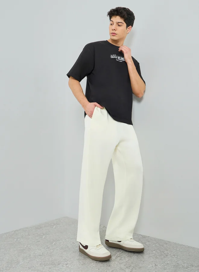 ستايلي Men Oversized Pants with Pocket Badge