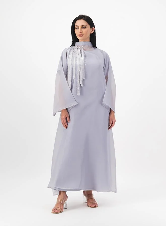 ميم باي ماريا Closed abaya with hanging tassel details on front and back. Comes with inner
