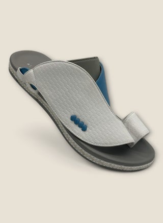 grey/white slippers with blue accents