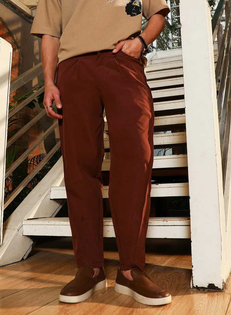 Campus Sutra Campus Sutra Men's Chestnut Brown Pleated-Tapered Trousers | Mid-Rise , Straight Hem , Button Closure | Solid Plain | Polyester Blend Trousers For Casual Wear