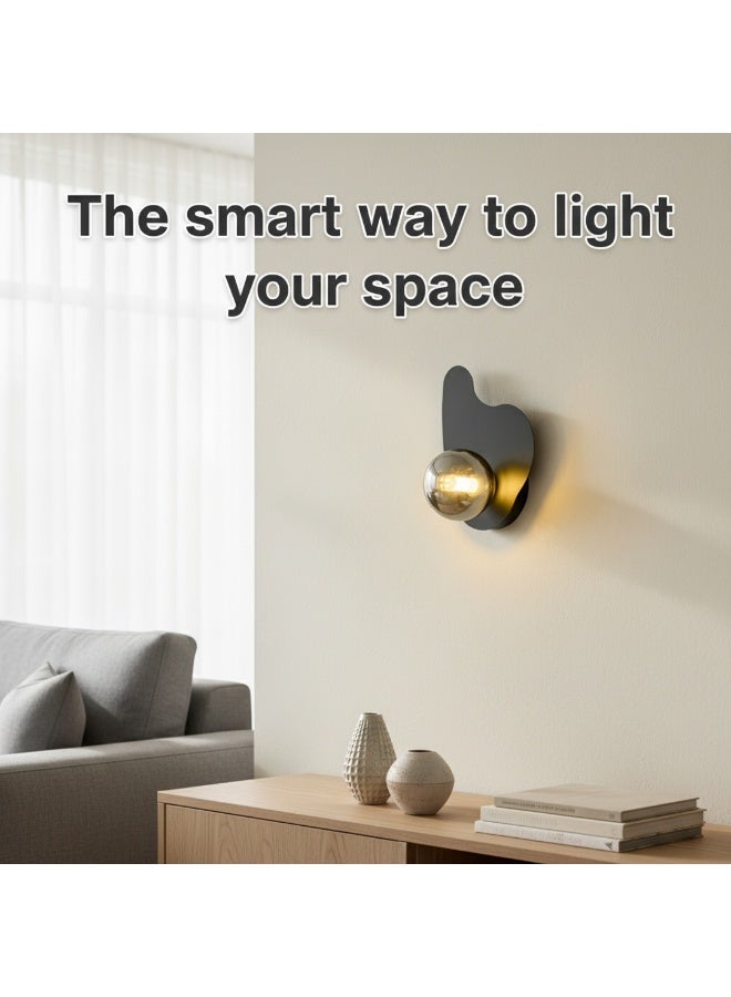 Modern black vertical wall lamp with an artistic curved design and imported fumé glass globe. Ideal for bedrooms, hallways, entrances, and contemporary living spaces.G9