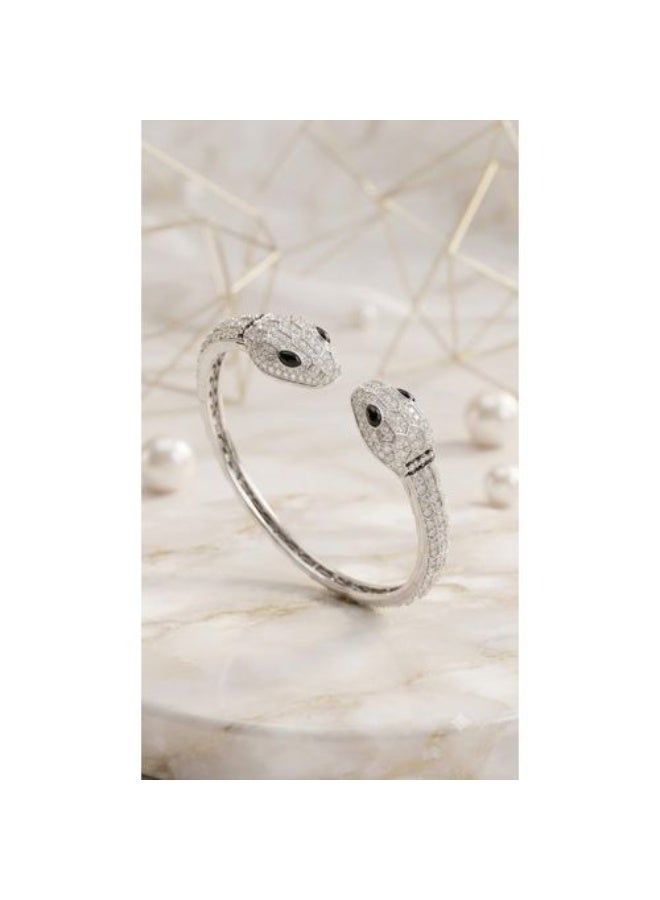 Stainless Steel Dual-Headed Serpentine Bangle Bracelet with Rhodium Finish, Paved Crystals, and Black Gemstone Eyes