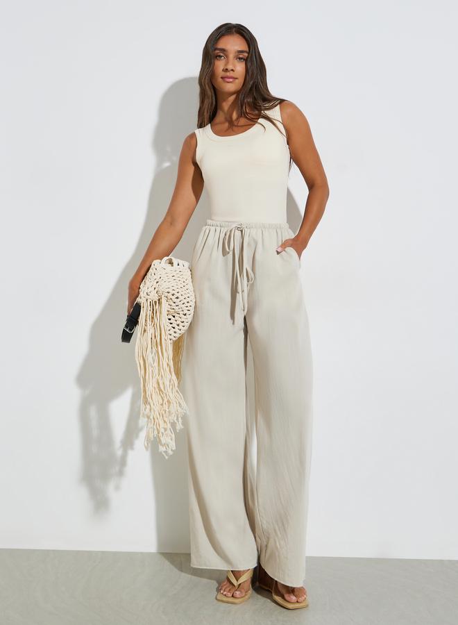 Styli Solid Elastic Waist Wide Leg Pants - Image 1
