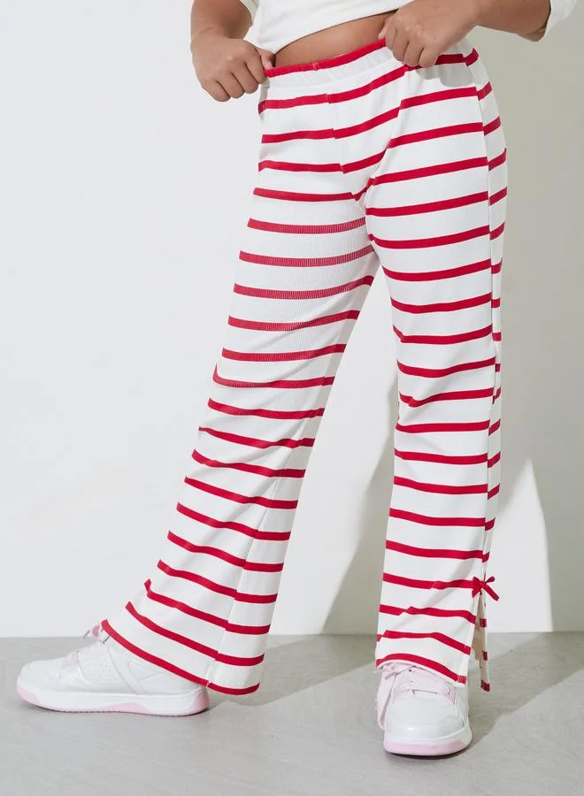 Styli Teen Girls Striped Ribbed Knit Flare Leggings with Side Bow Slits
