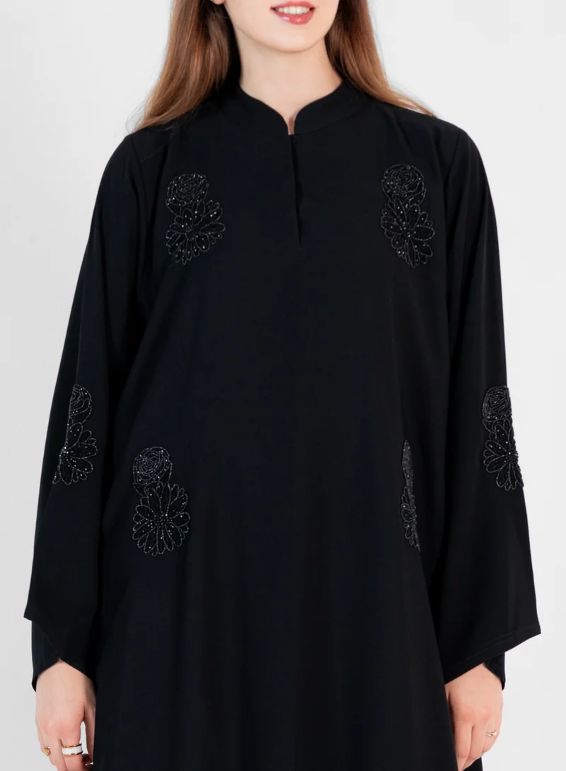 Rosette Abaya High neck closed abaya with hand embroidered black flowers and wide sleeves