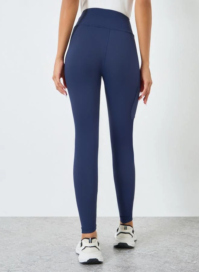 Styli Active Navy Blue Women Knee Rubber Logo Side Pocket Leggings for Women | Best Price UAE