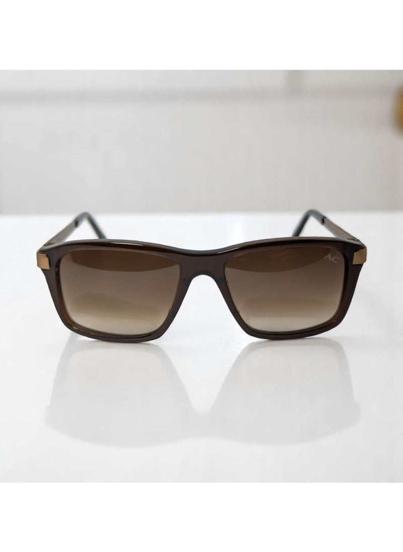 Armando Cavelli - Authentic Armando Cavelli sunglasses, crafted from carefully selected premium acetate for a luxurious look and longevity with extensive use. This model combines modernity and classic style, with a raw brown acetate front and brown -plated metal temples to complete your luxury look. Comes with premium polymer lenses offer UV400 protection in a gradient brown. - Image 1