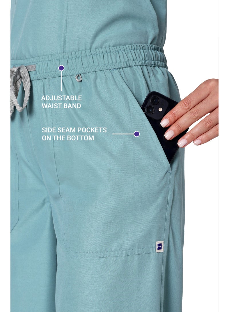 KNYA زيّ طبي نسائي كلاسيكي من KNYA بخمسة جيوب | ياقة على شكل حرف V | تصميم مرن ومريح للجزء العلوي والسفلي | جيوب يسهل الوصول إليها | زيّ موحد للأطباء | (لون الأوكالبتوس، مقاس 2XL) - Image 4