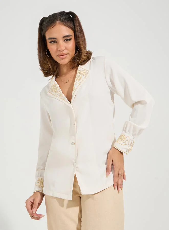 تايك تو بلوزة بقصة عادية وتفاصيل مُطرّزة