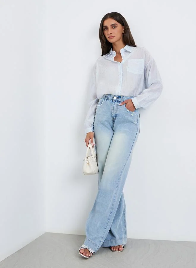 ستايلي قميص بقصة واسعة وأكمام طويلة