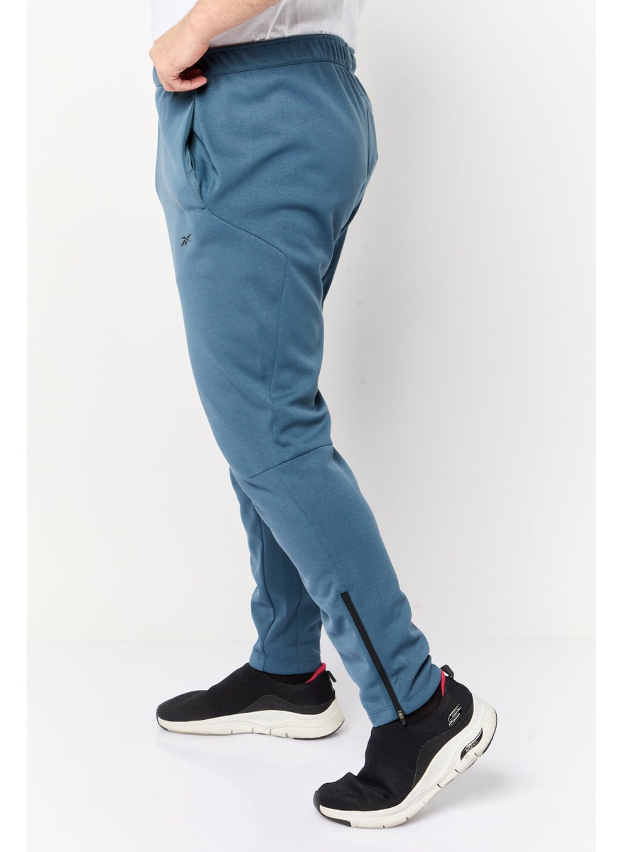 Reebok Men Sportswear Fit Brand Logo Outdoor Sweatpants, Teal Blue  - Image 3
