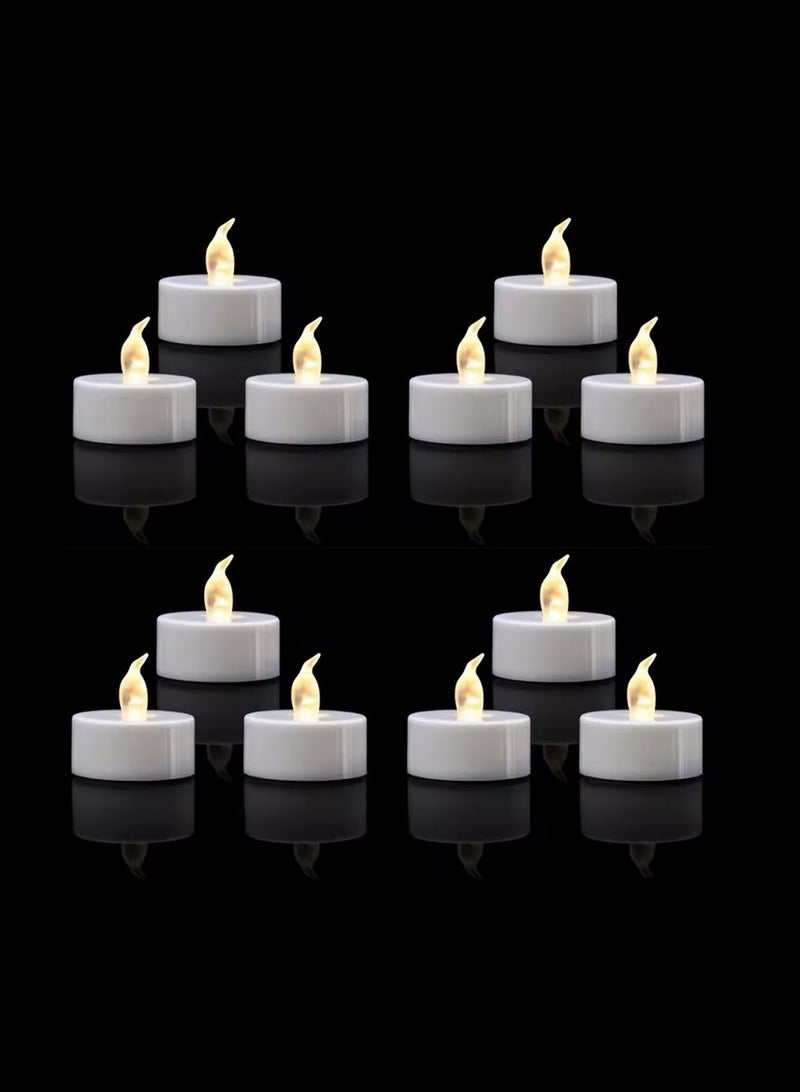 شموع الشاي بتقنية - عبوة تحتوي على 12 شمعة صناعية بدون لهب باللون الأصفر الدافئ أو الأبيض الدافئ، تدوم 150 ساعة وتعمل بالبطارية، مثالية للديكور. - Image 1