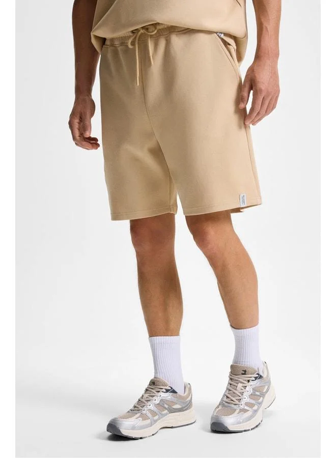 Grimelange BAILEY Men's Elastic Waist Single Back Pocket Corded Relaxed Fit Beige Shorts.