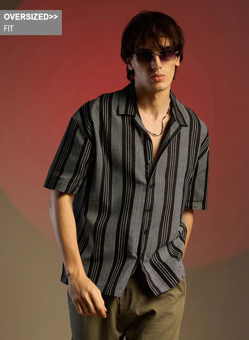 Campus Sutra Campus Sutra Men's Obsidian Black Woven Striped Oversized Shirt For Casual Wear | Cuban Collar | Short Sleeve | Button Closure | Oversized Shirt Crafted With Comfort Fit For Everyday Wear