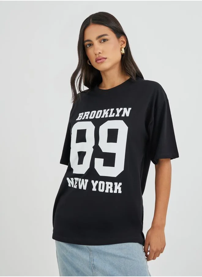 ستايلي Styli Brooklyn 89 Slogan Print Short Sleeve Oversized T-Shirt