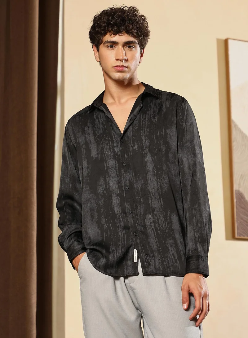 Campus Sutra Men Gleaming-Grazed Satin Shirt | Spread Collar , Long Cuffed Sleeves | Button Closure Curved Hem | Abstract Print Plain | Woven Fabric For Party & Evening Wear | Midnight Black