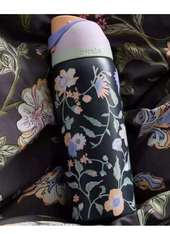 Owala - 32 Oz. Owala FreeSip Stainless Steel Water Bottle in Black with flower - Image 1